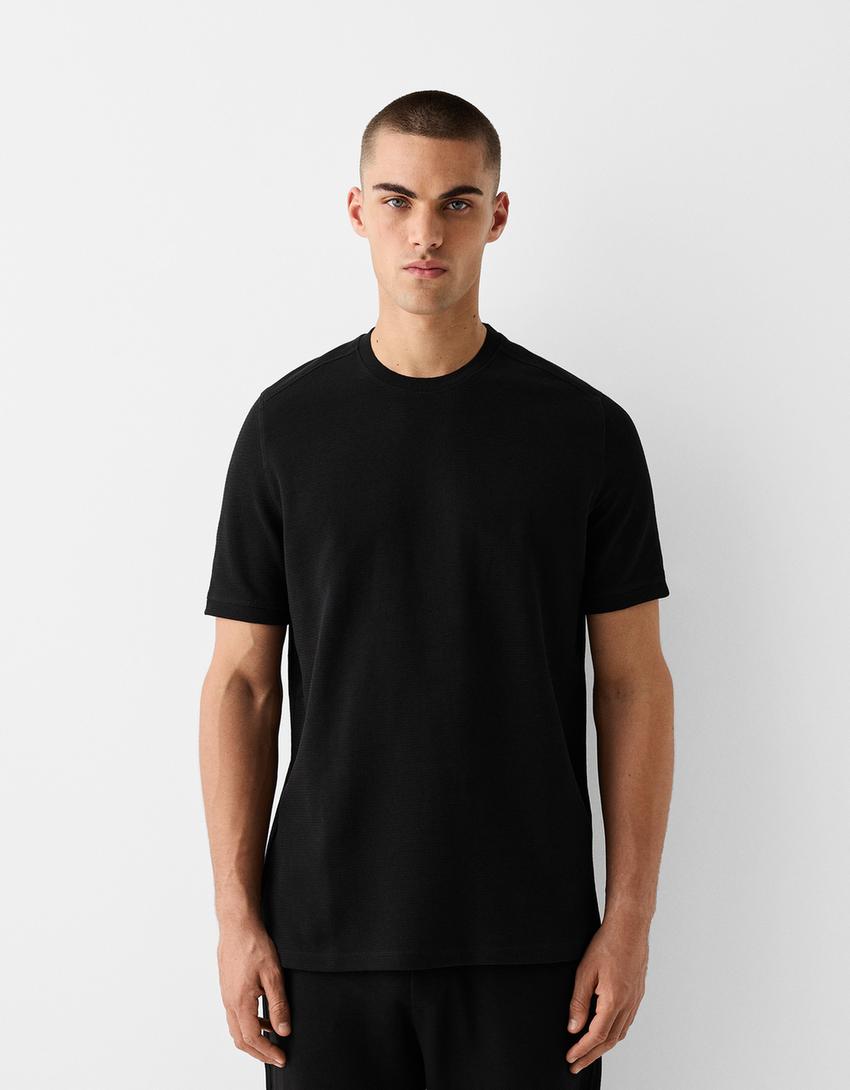 T-shirt Kenneth Cole Reaction - Poche zippée - Taille L T-shirt Kenneth Cole Reaction - Poche zippée - Taille L
