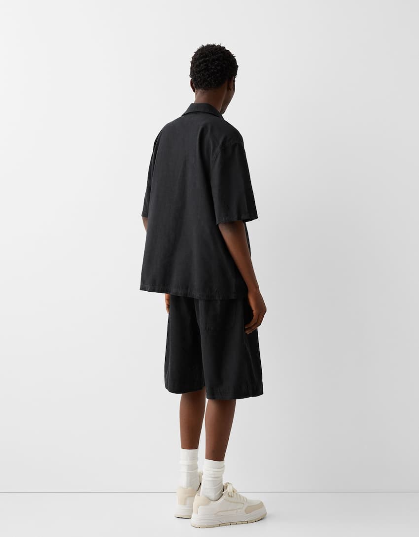 Garment-dyed wide-leg Bermuda shorts - Men | Bershka