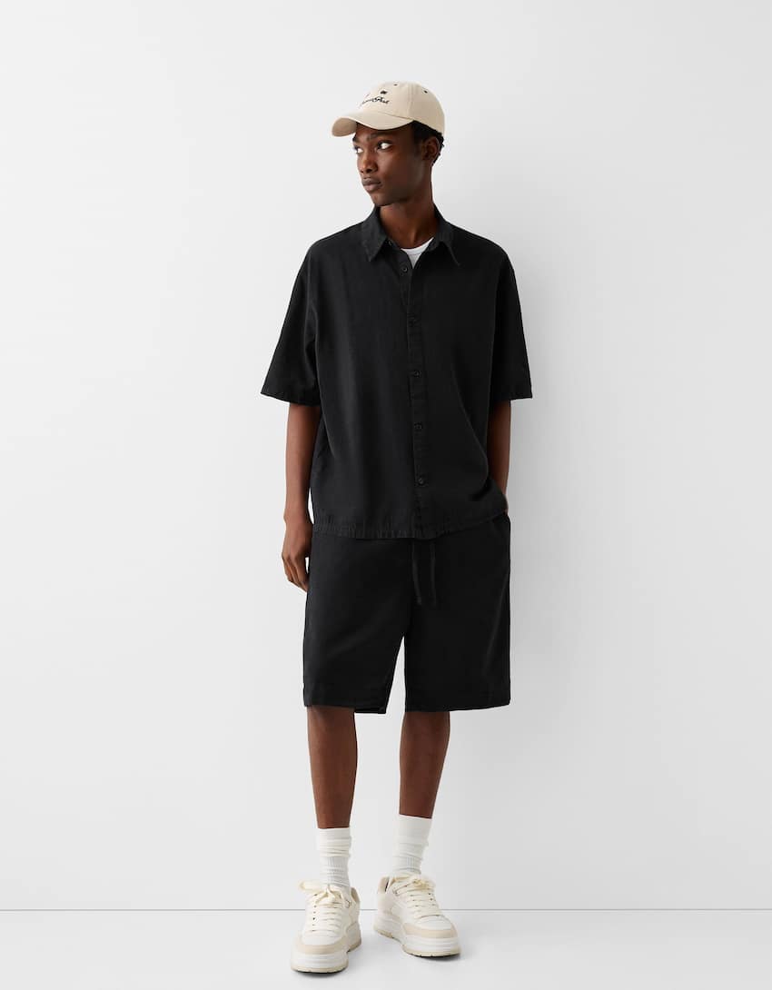 Garment-dyed wide-leg Bermuda shorts - Men | Bershka