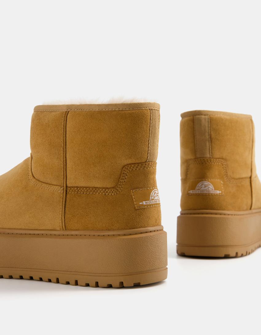 بوت برقبة للكاحل بنعل سميك وبطانة من فرو اصطناعي.-جلد-3