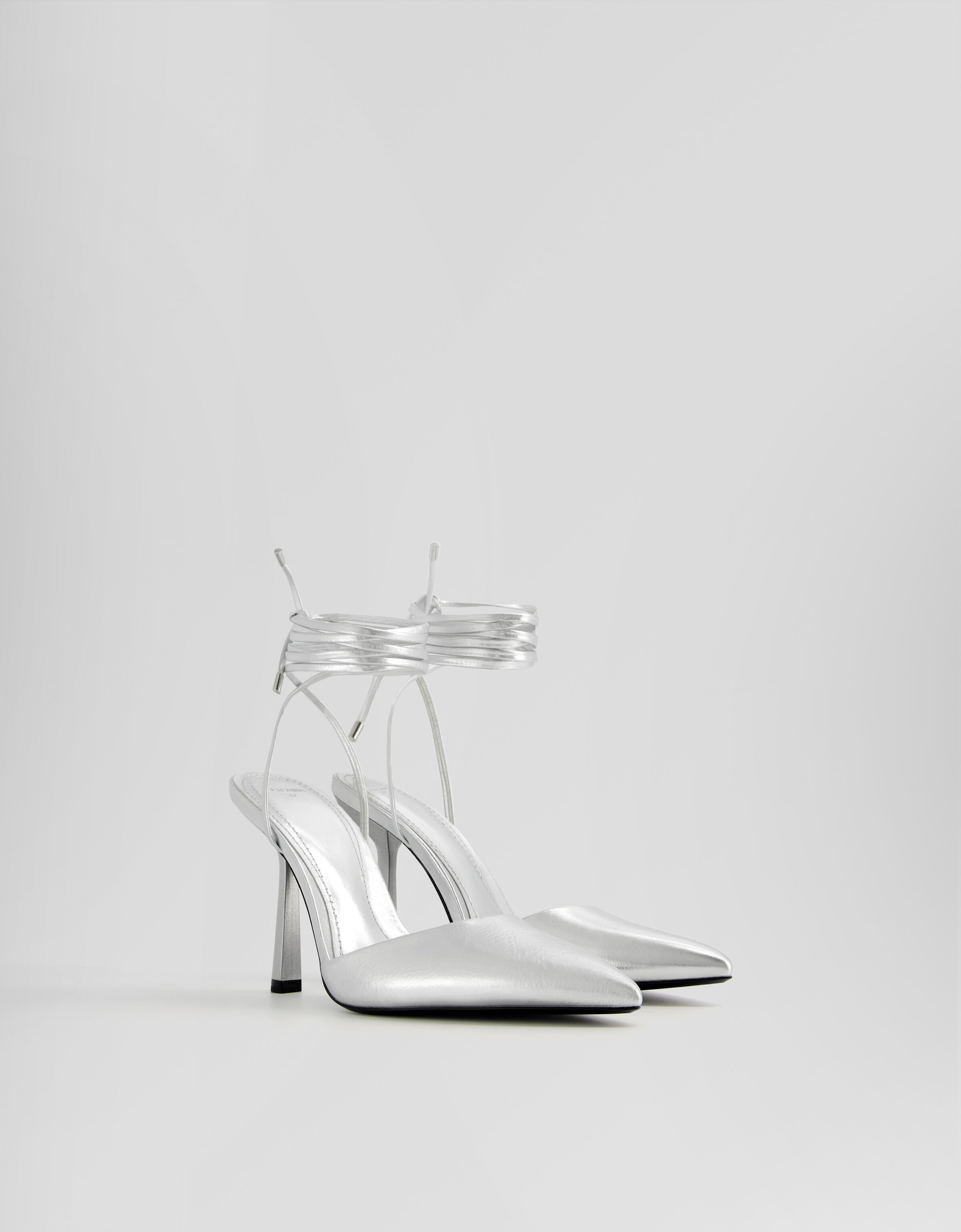 Metallic lace up high heel shoes