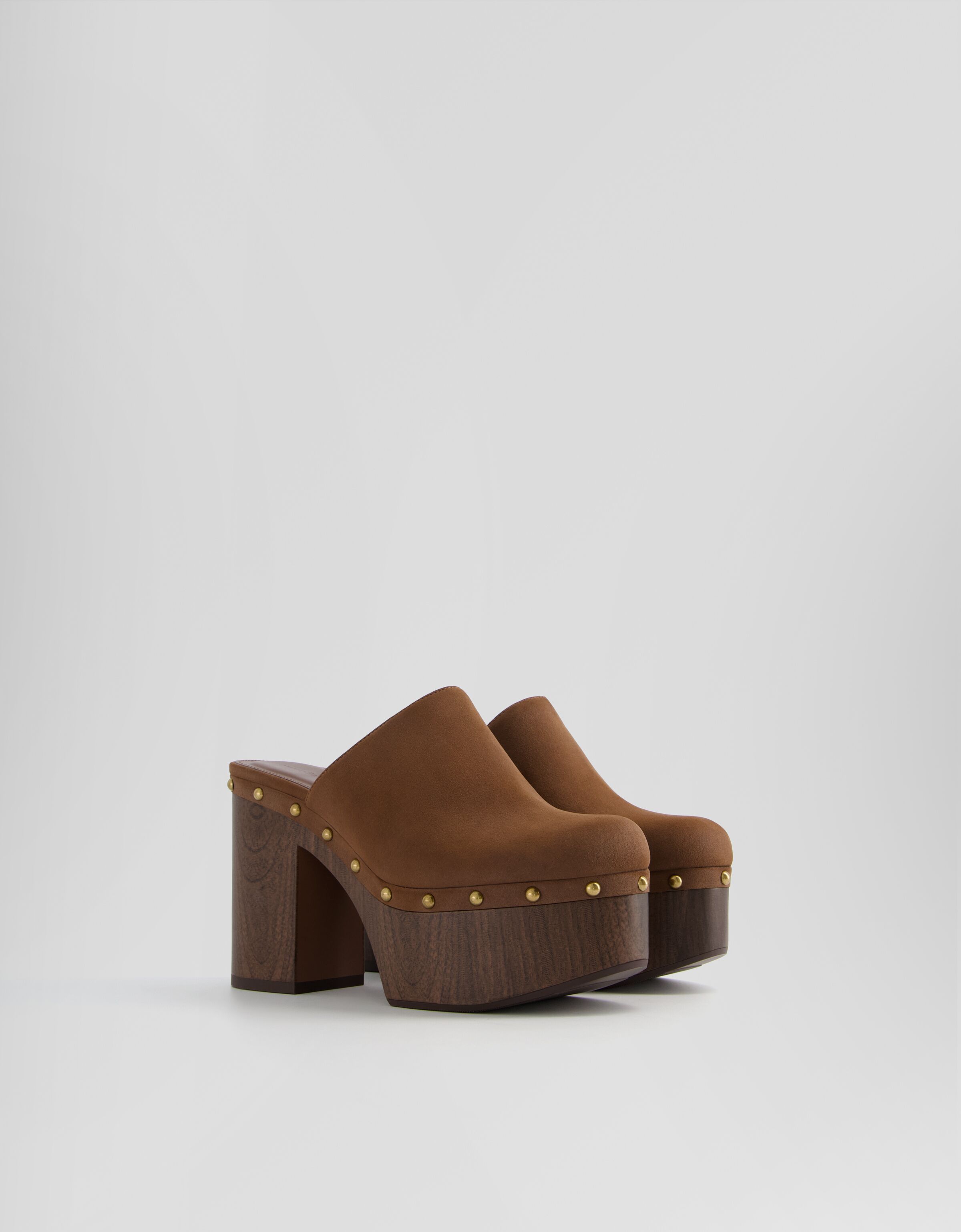Studded platform heeled clogs