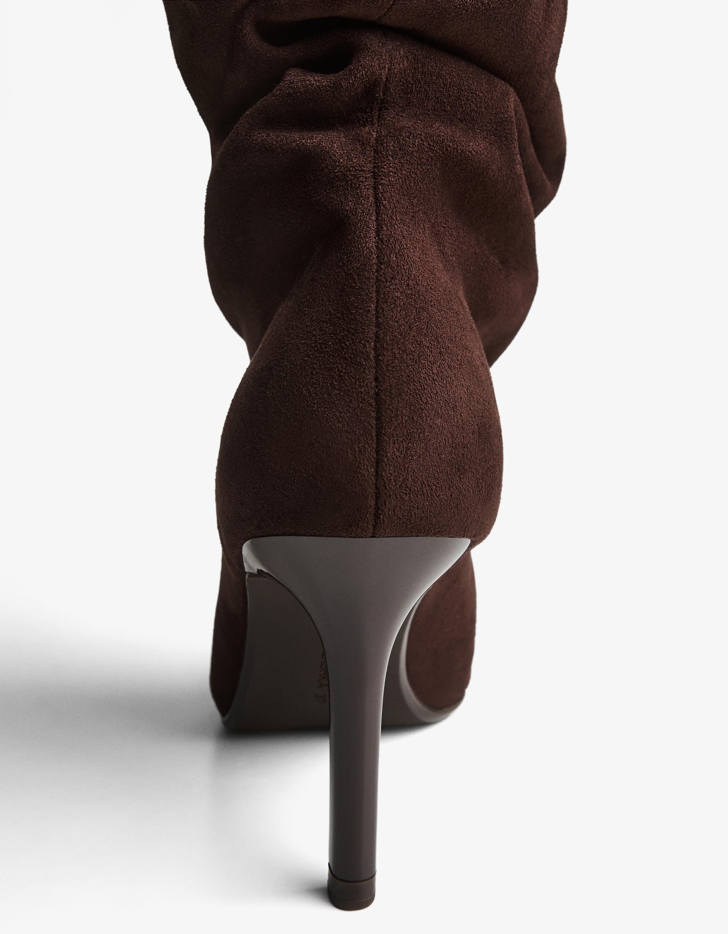 Split stiletto heel boot