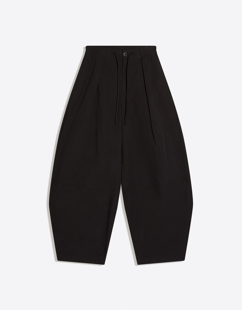 Pantaloni tecnici con pieghe-Nero