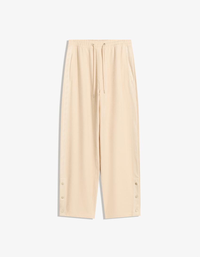 Pantaloni balloon fit jogger con borchie-Avorio