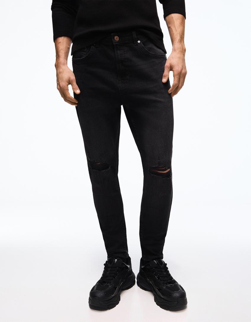 Carrot fit jeans met scheuren-Zwart