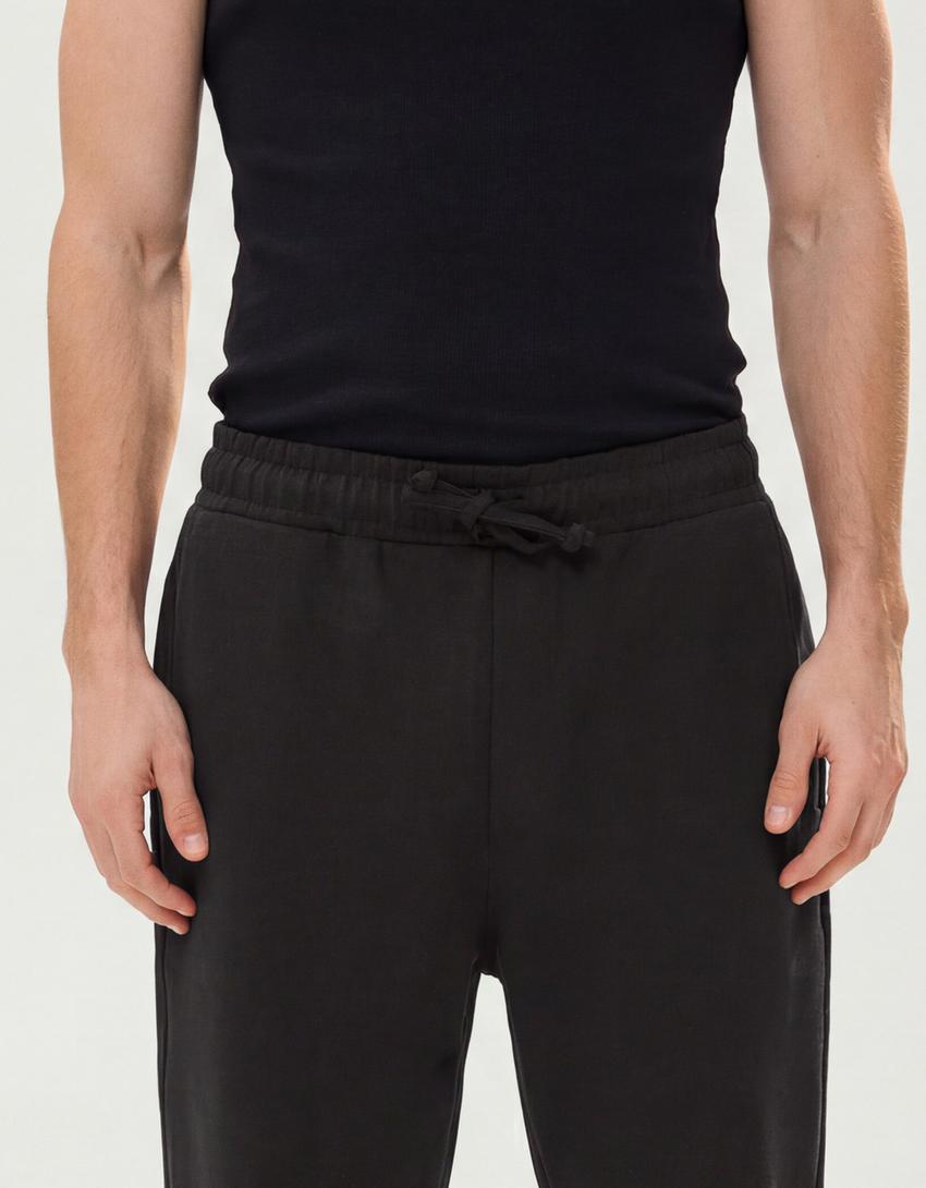 Interlock broek met wijde pijpen-Zwart