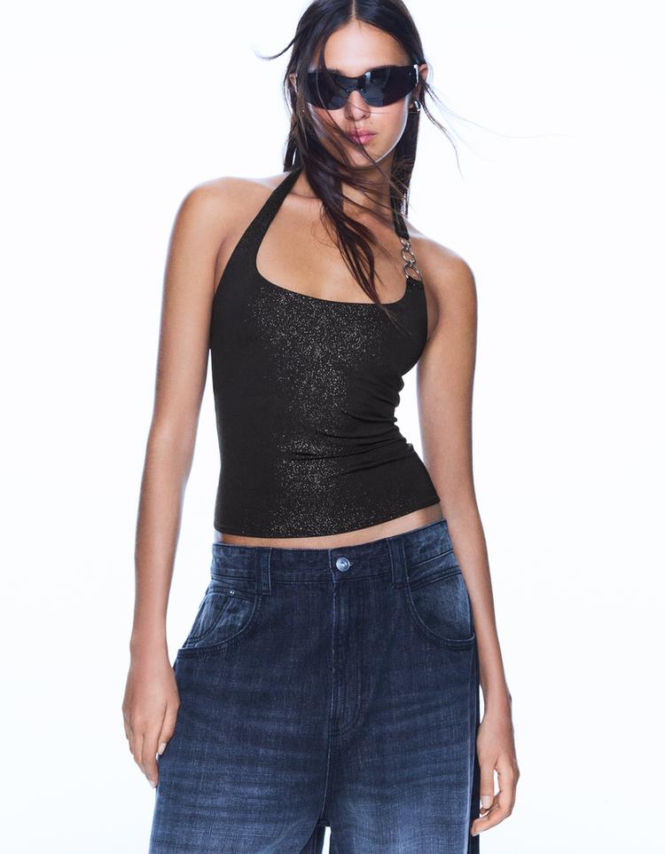 Loose-fitting top with eyelets