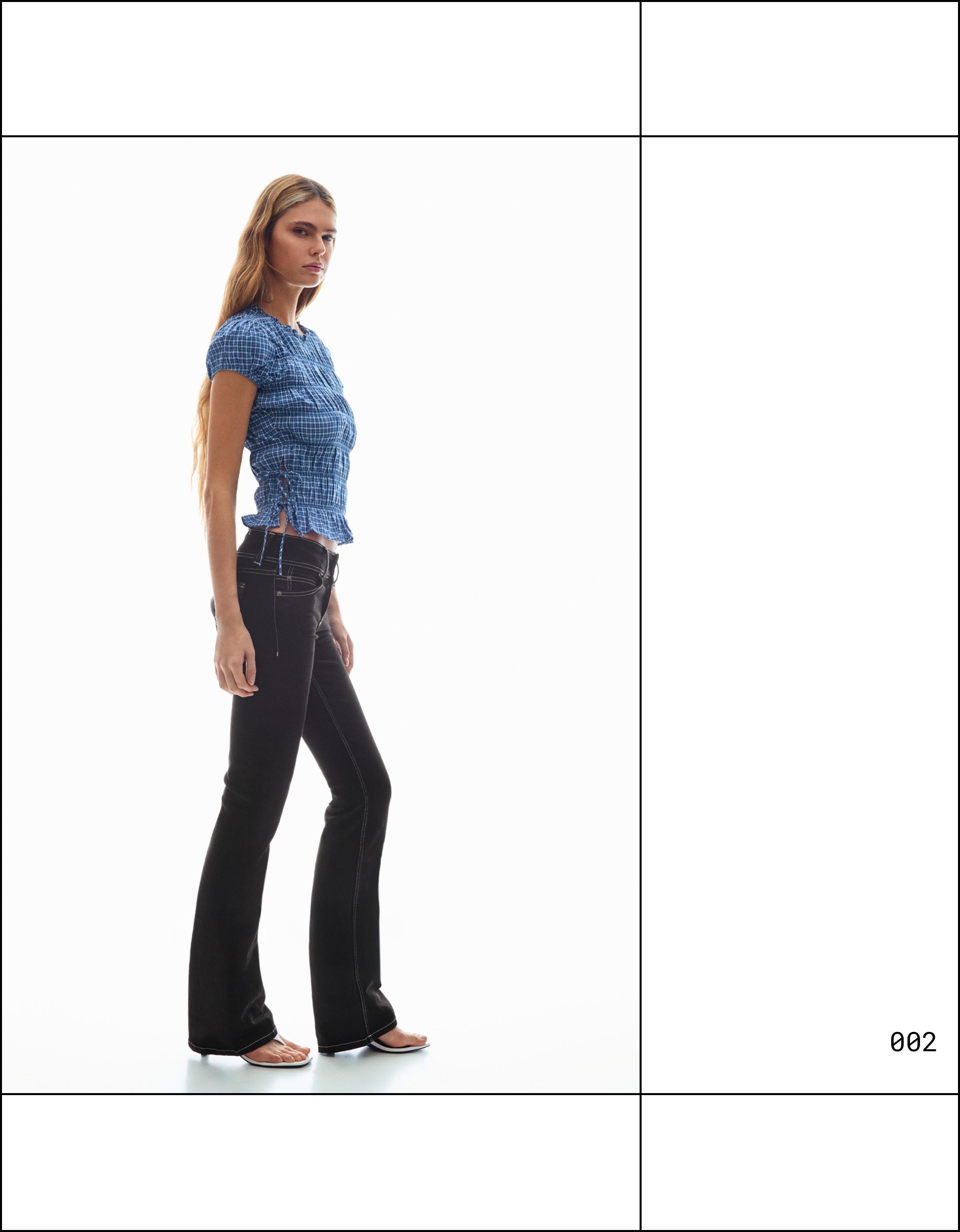 Low-rise boot-cut jeans with flaps