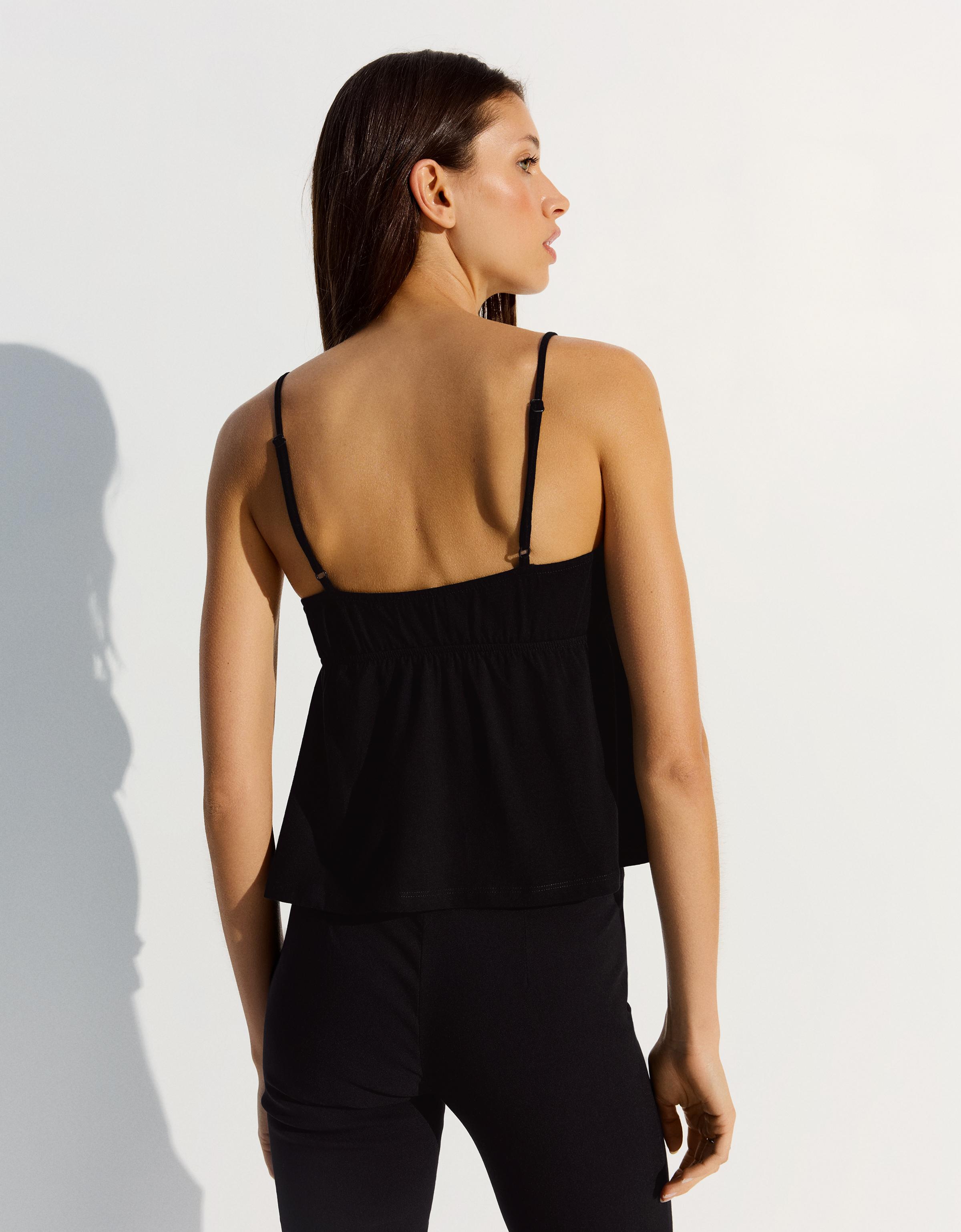 Peplum strappy top — Black