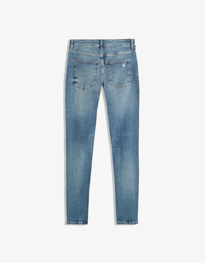 Jeans super skinny strappati-Azzurro Lavato