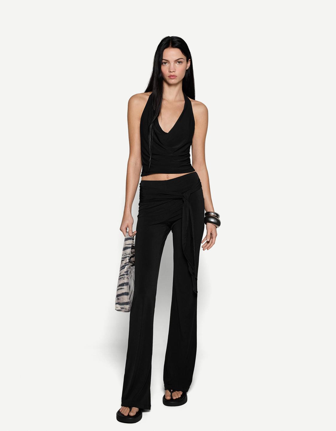 Flare trousers with tied front