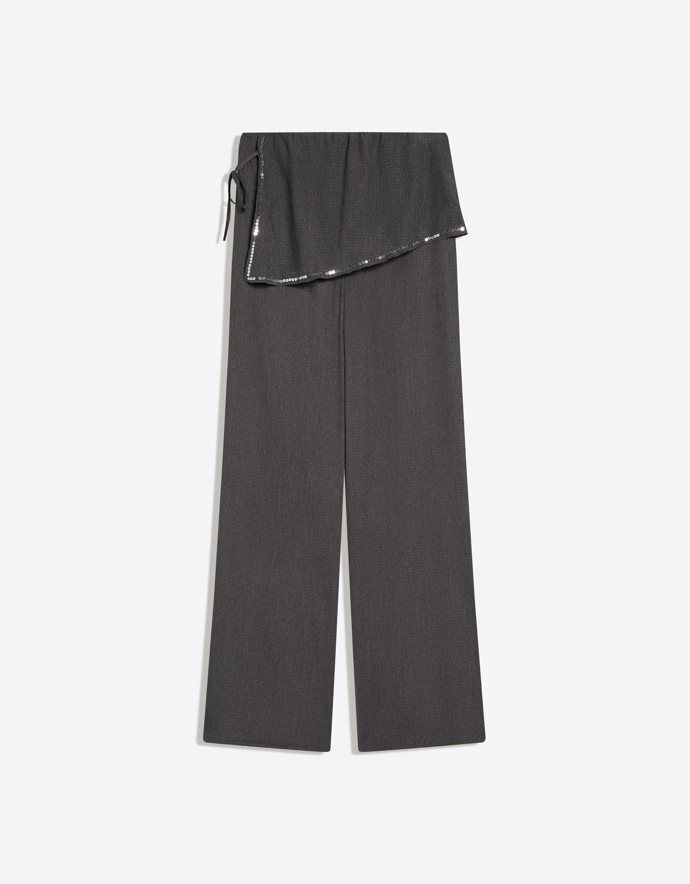 Trousers with sequin overskirt