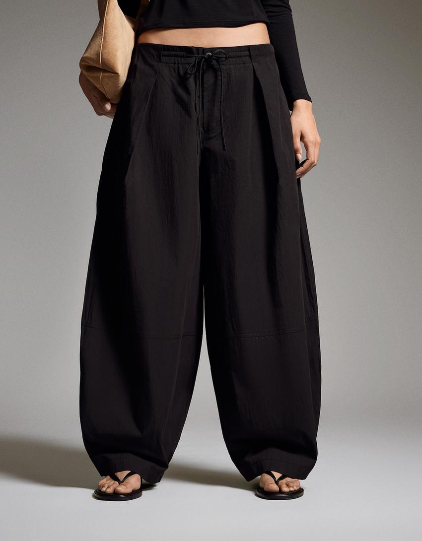 Pantaloni tecnici con pieghe-Nero