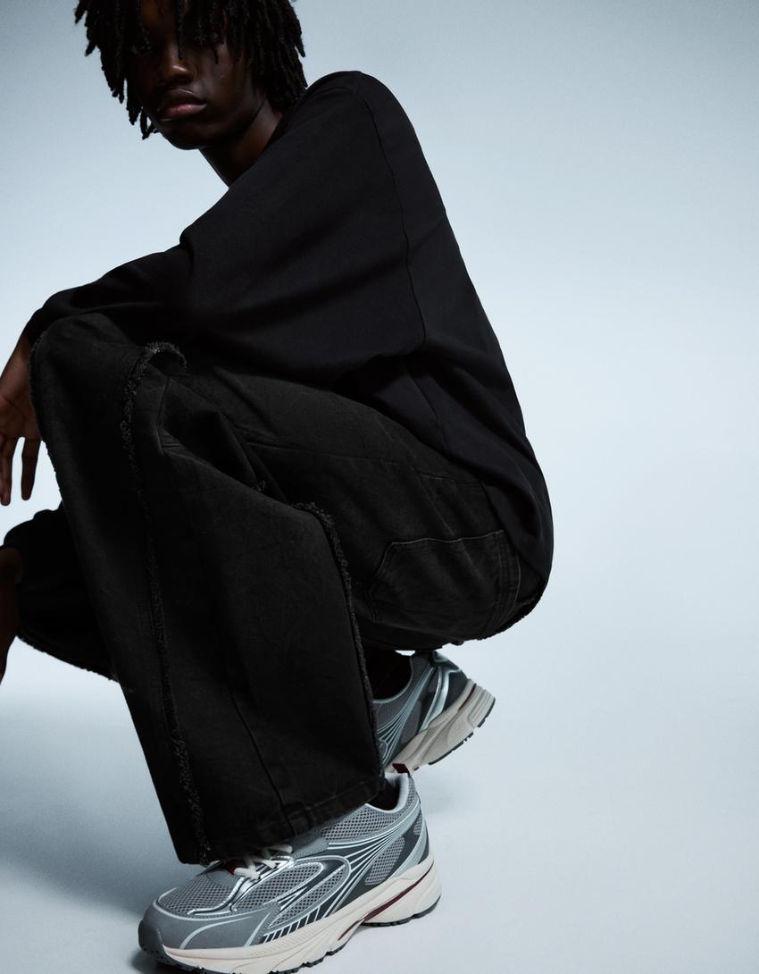 Calças superbaggy com franjas-Preto