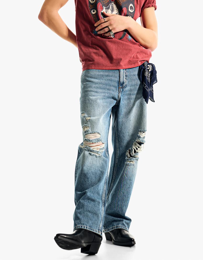 Džinsi ‘baggy fit’ ar plēsumiem-Zils