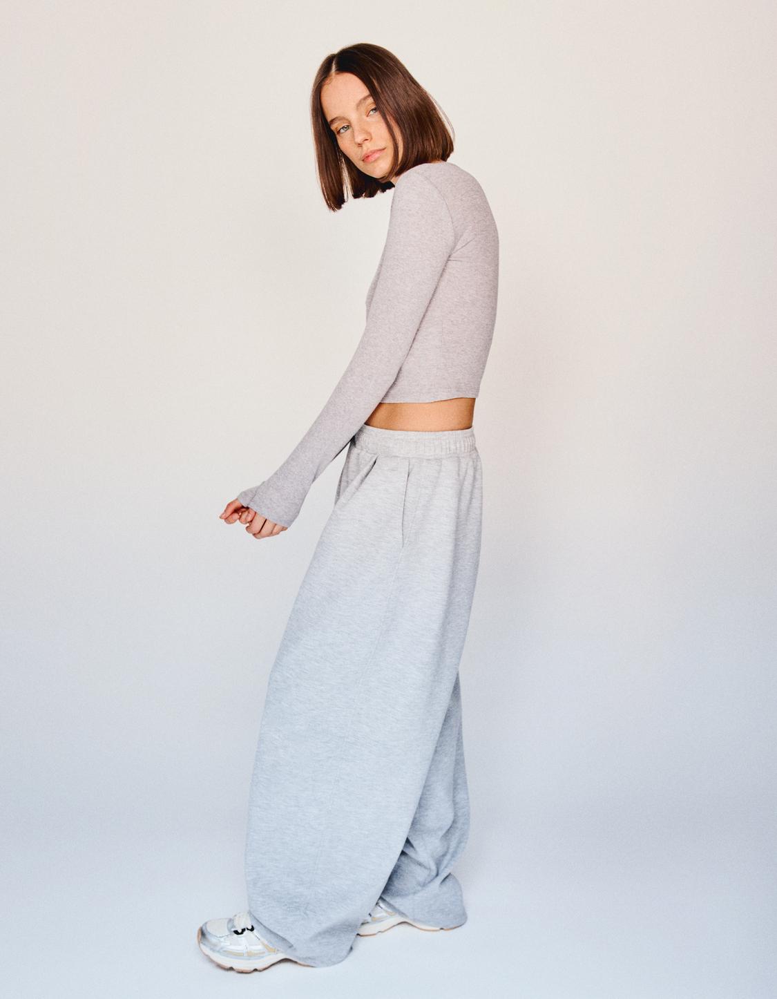 Long sleeved button neck top