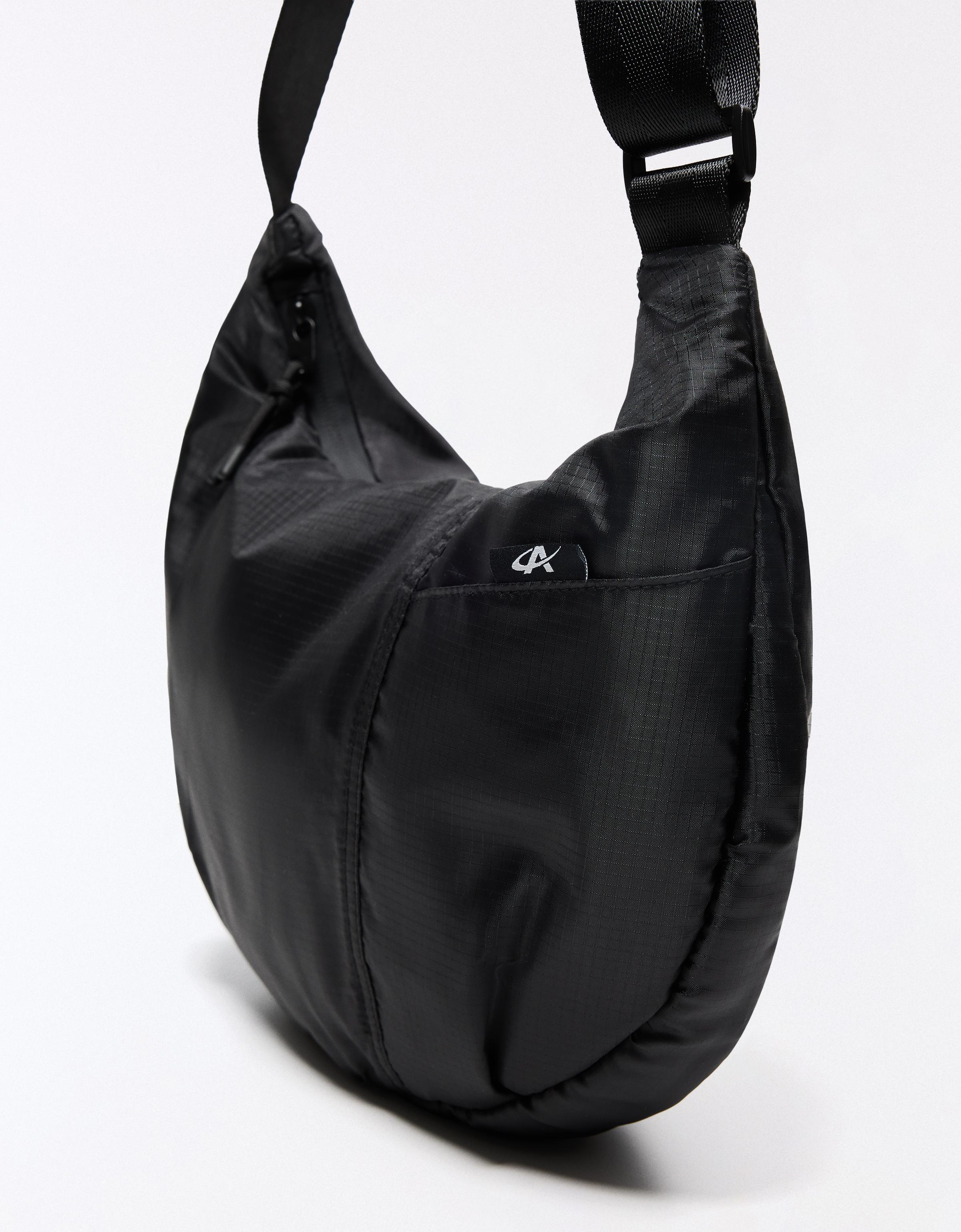 Technical multi-pocket bucket bag — Black