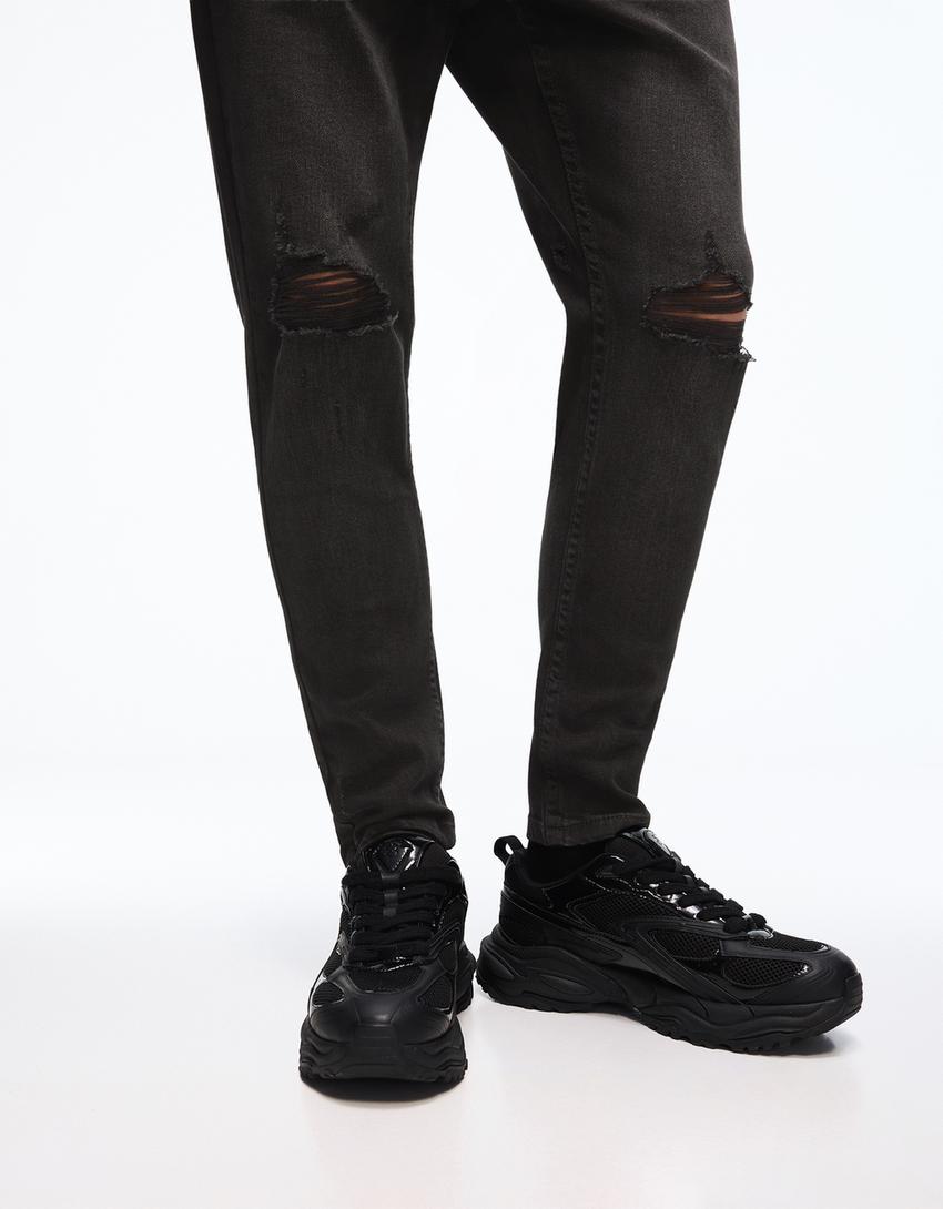 Carrot fit jeans met scheuren-Zwart