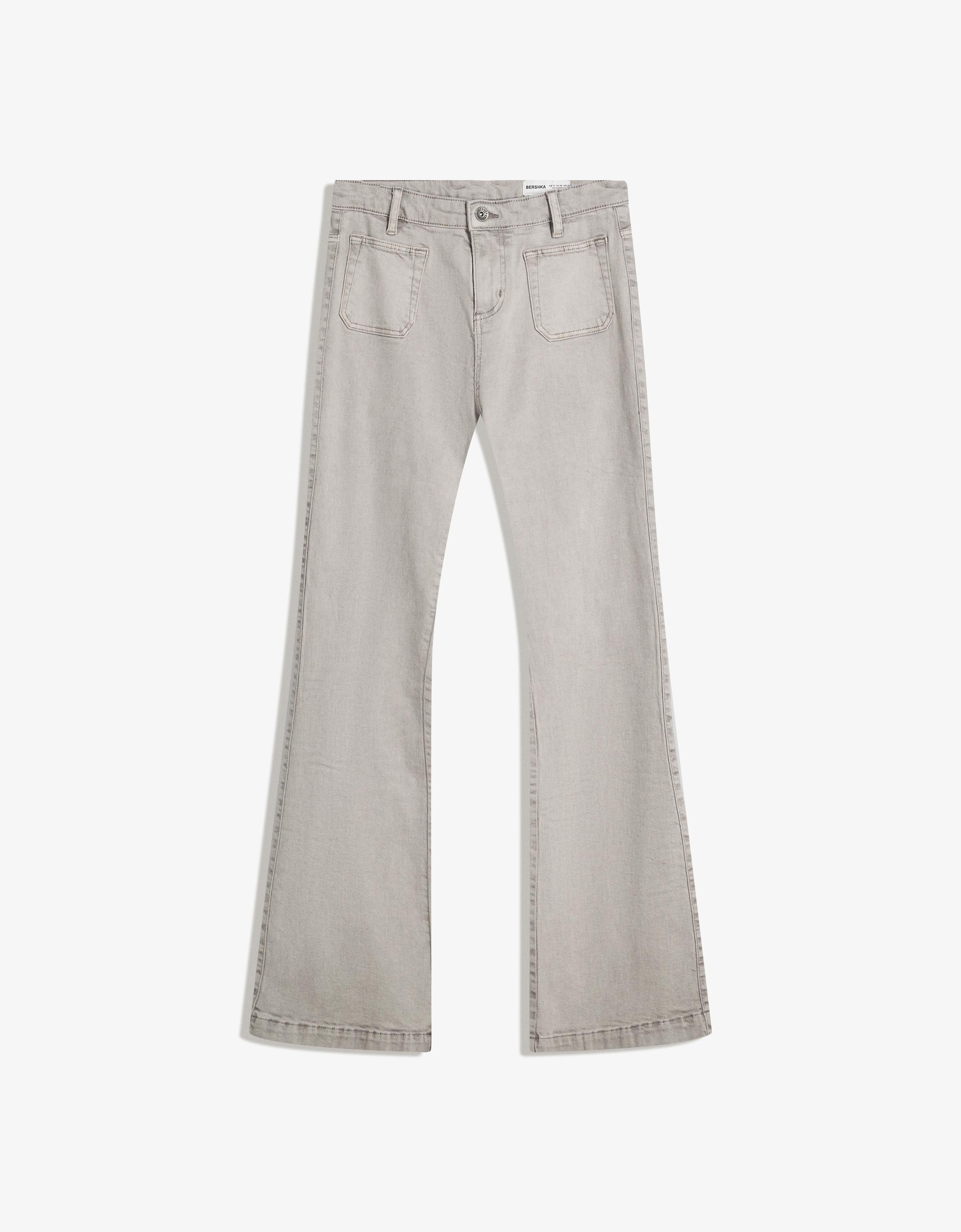Flare trousers with flaps and pocket