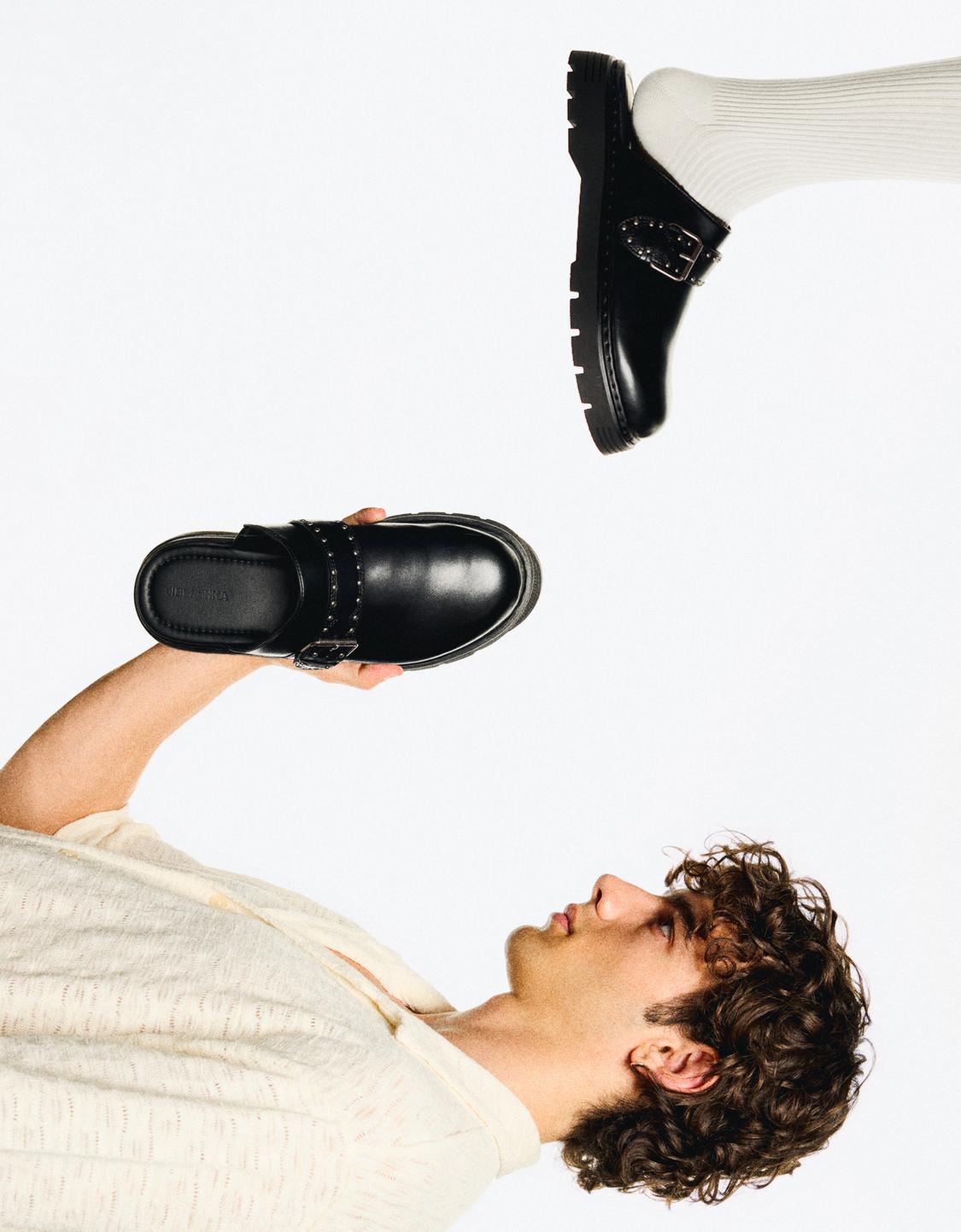 Buckled clogs