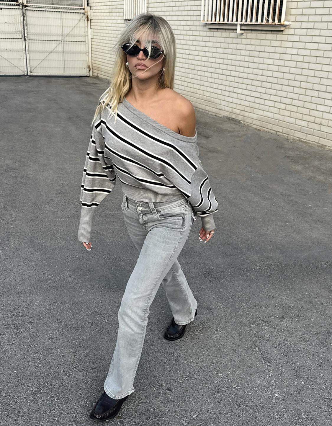 Asymmetric sweater with ribbed hem