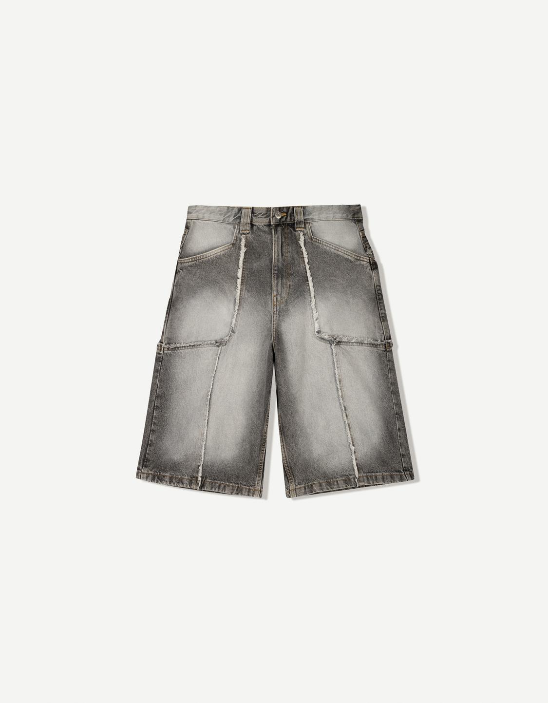 Baggy denim Bermuda shorts with fringing