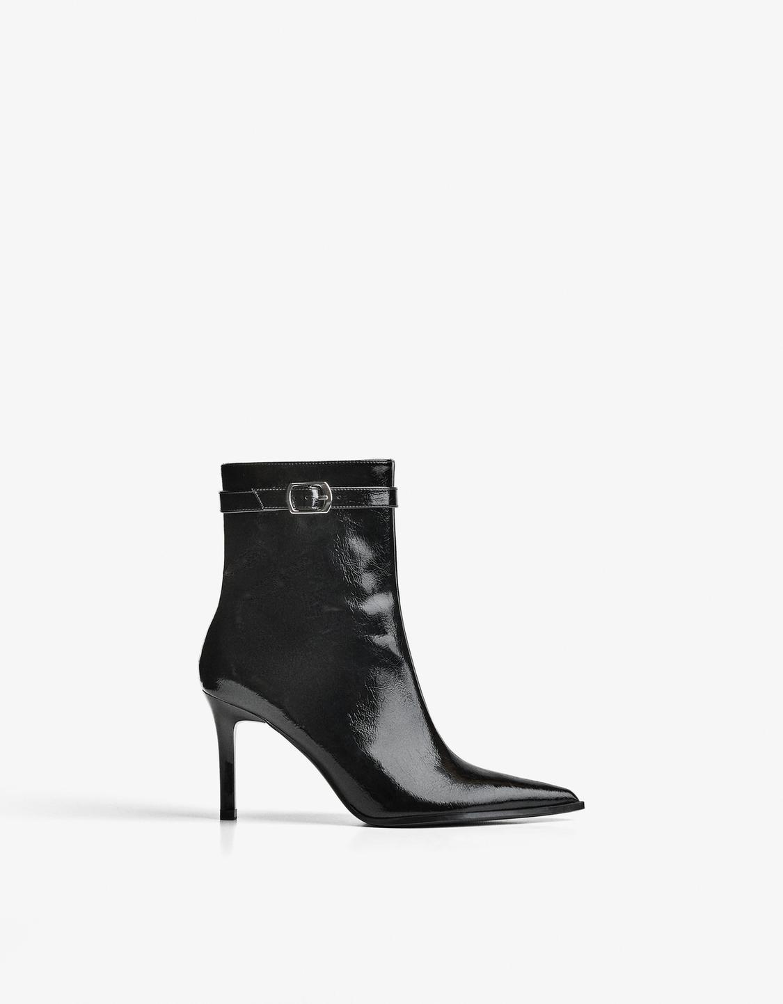High-heel ankle boots with buckled strap