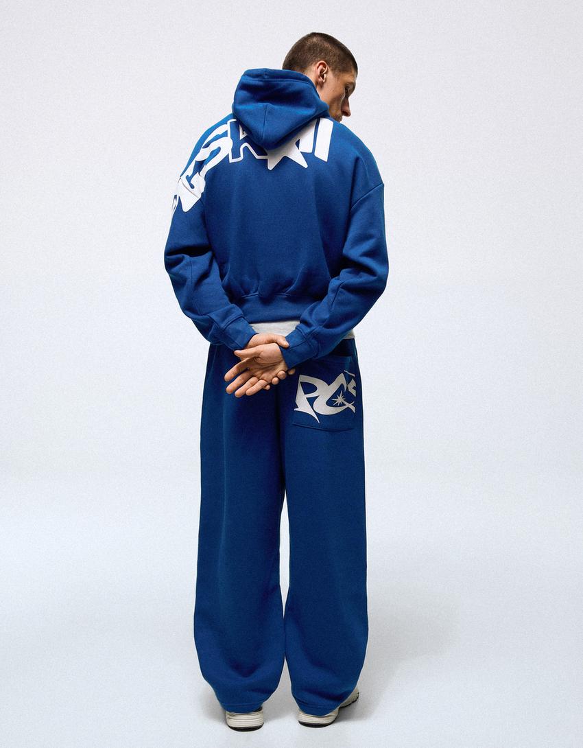 Hose mit Puffärmeln und seitlichem Print-Blau