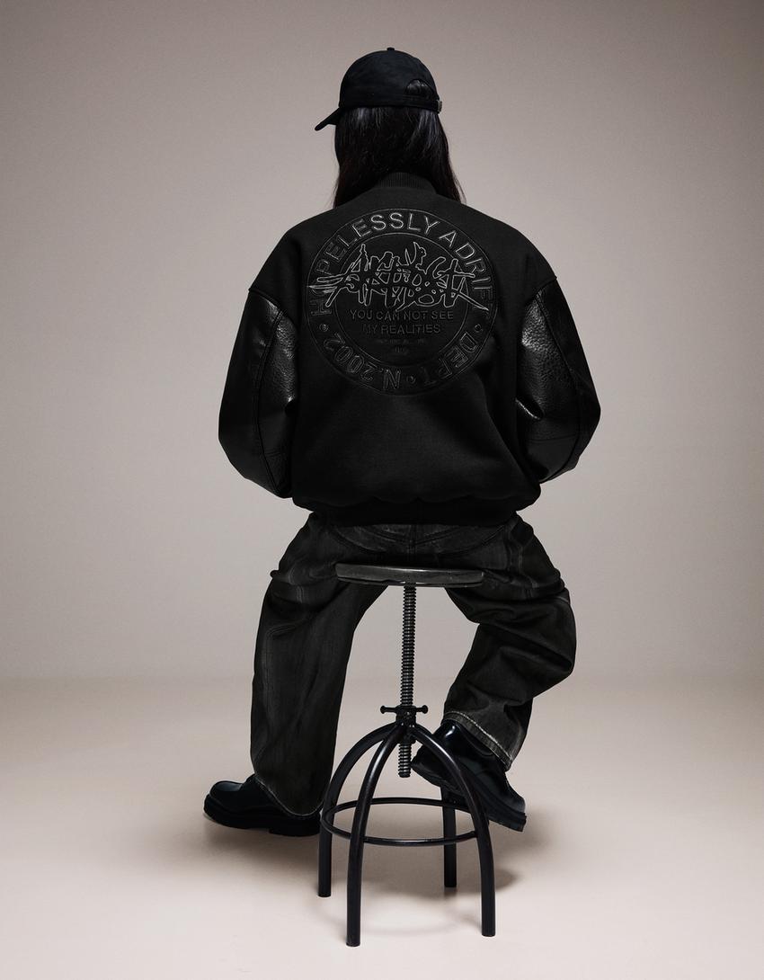 Jacke aus Tuch mit Ärmeln in Kunstlederoptik-Schwarz