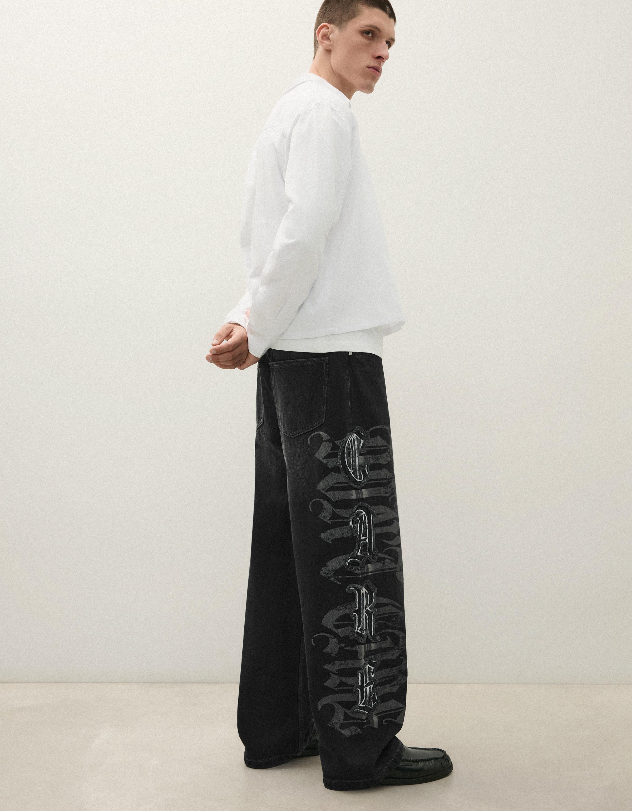 Baggy jeans with star patches — Black