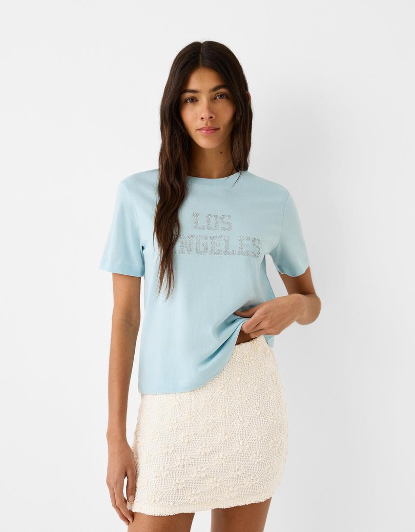 تنورة قصيرة بملمس بارز-كريمي-1