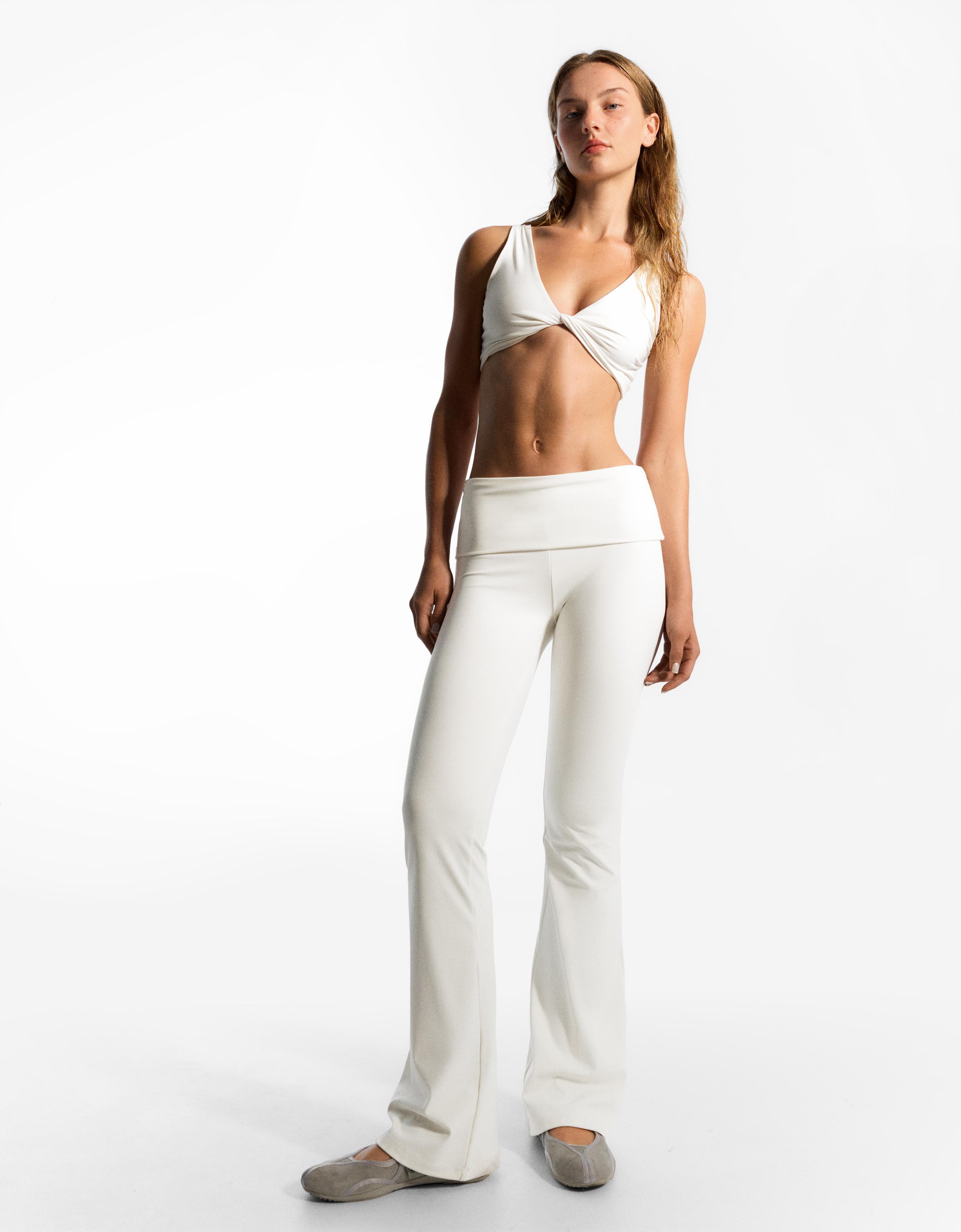 Flared technical trousers with turn-down waist