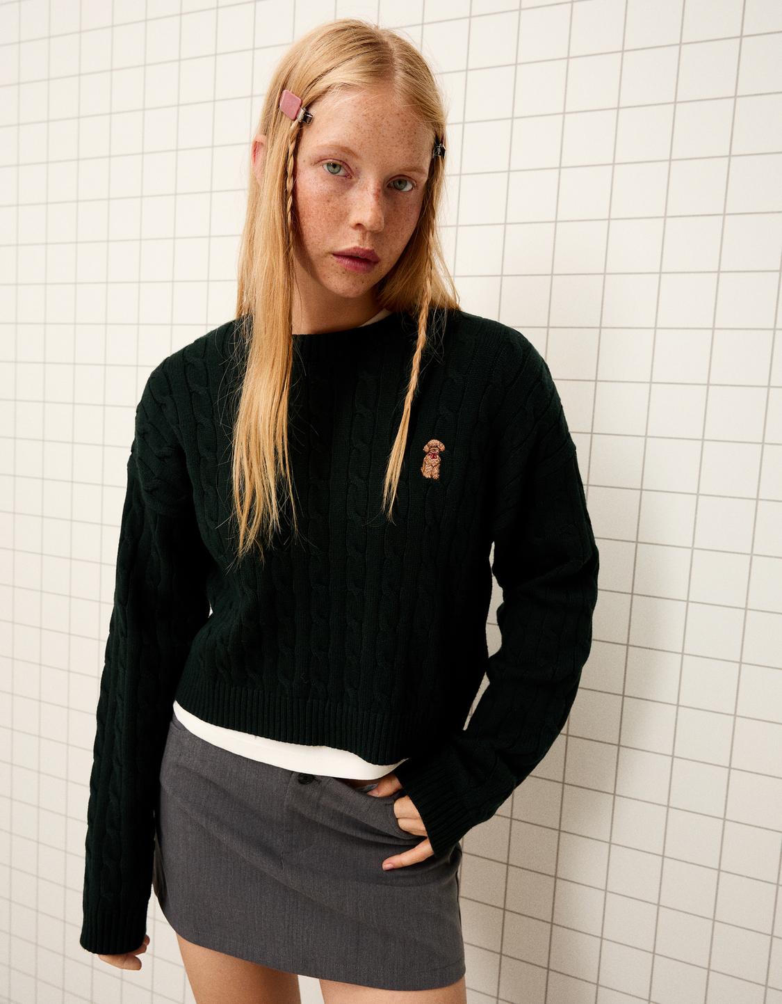 Embroidered cable-knit sweater