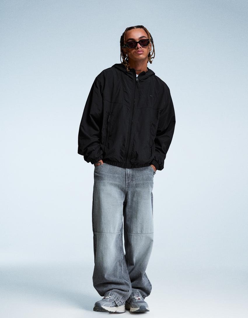 Hooded technical jacket