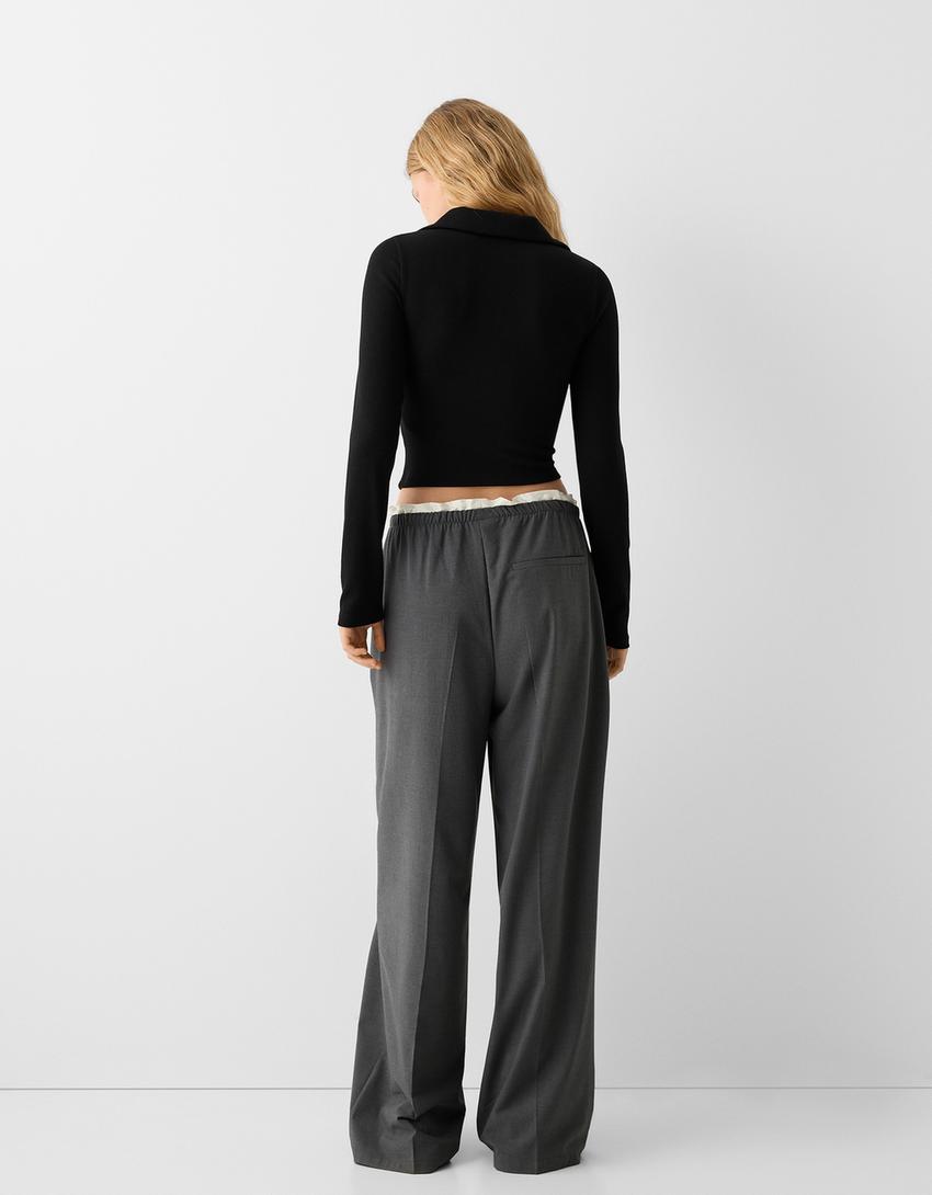 تيشرت بأكمام طويلة وياقة بولو وزمة وسحّاب-أسود-1