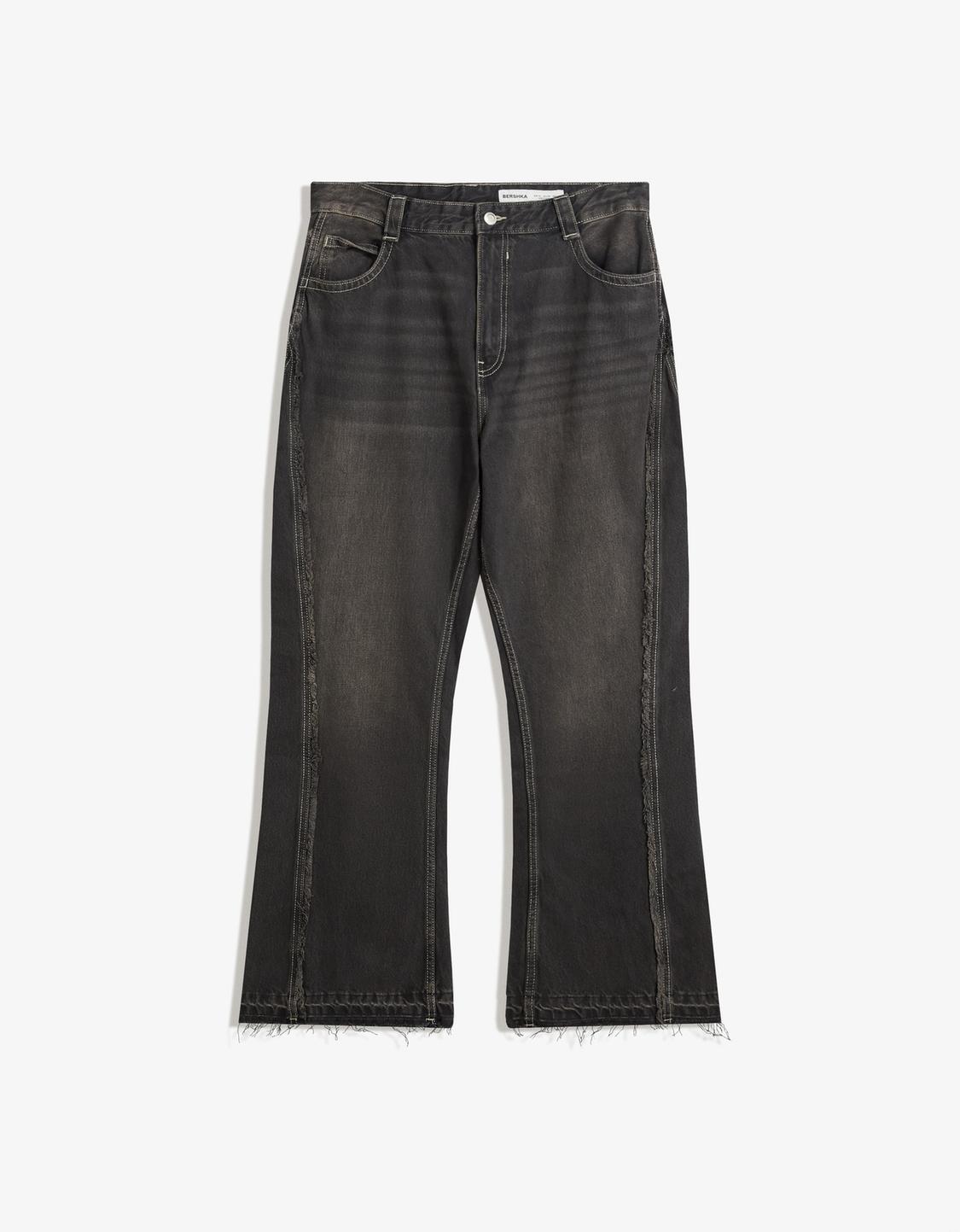 Flared jeans with fringing