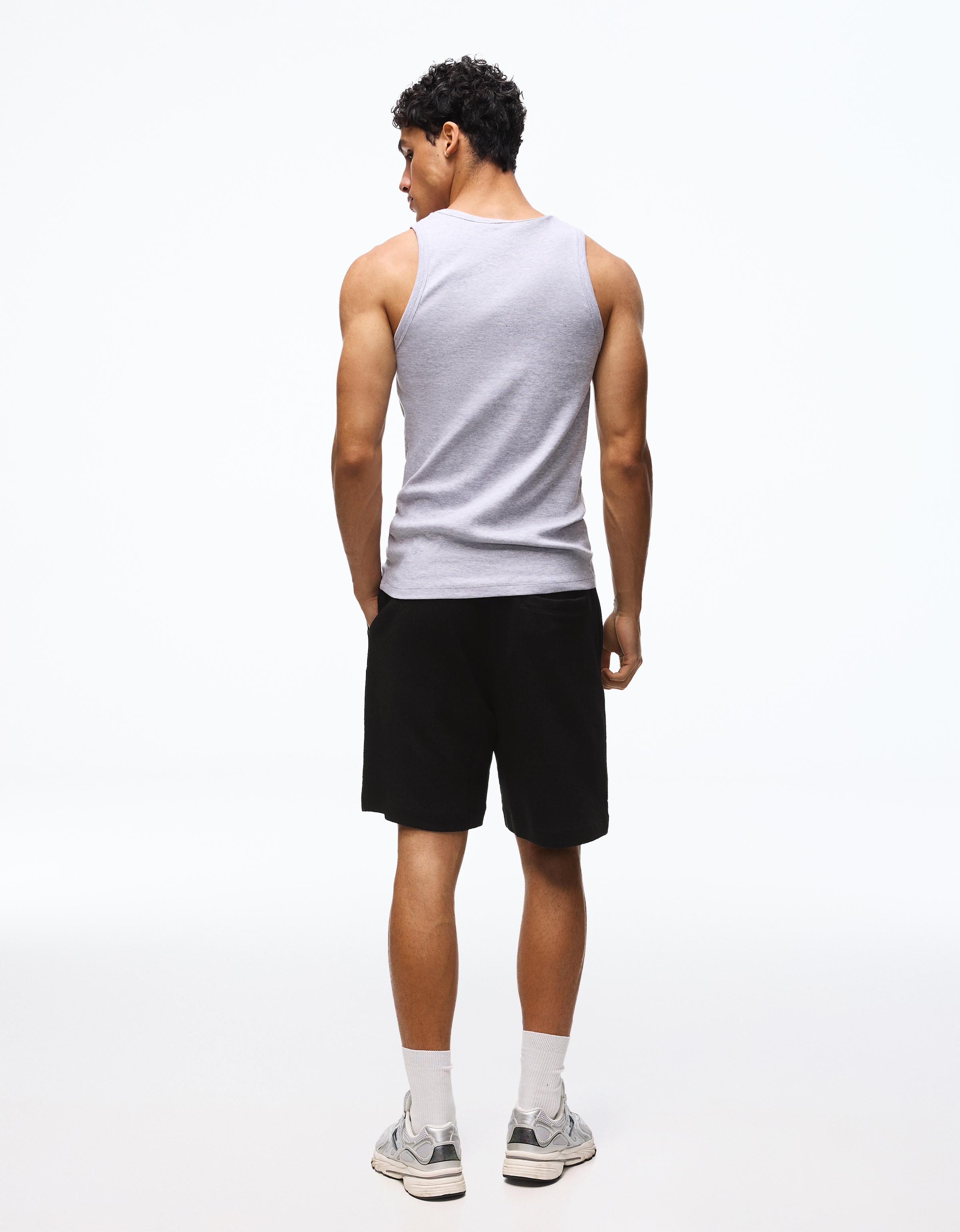 Textured plush Bermuda shorts — Black