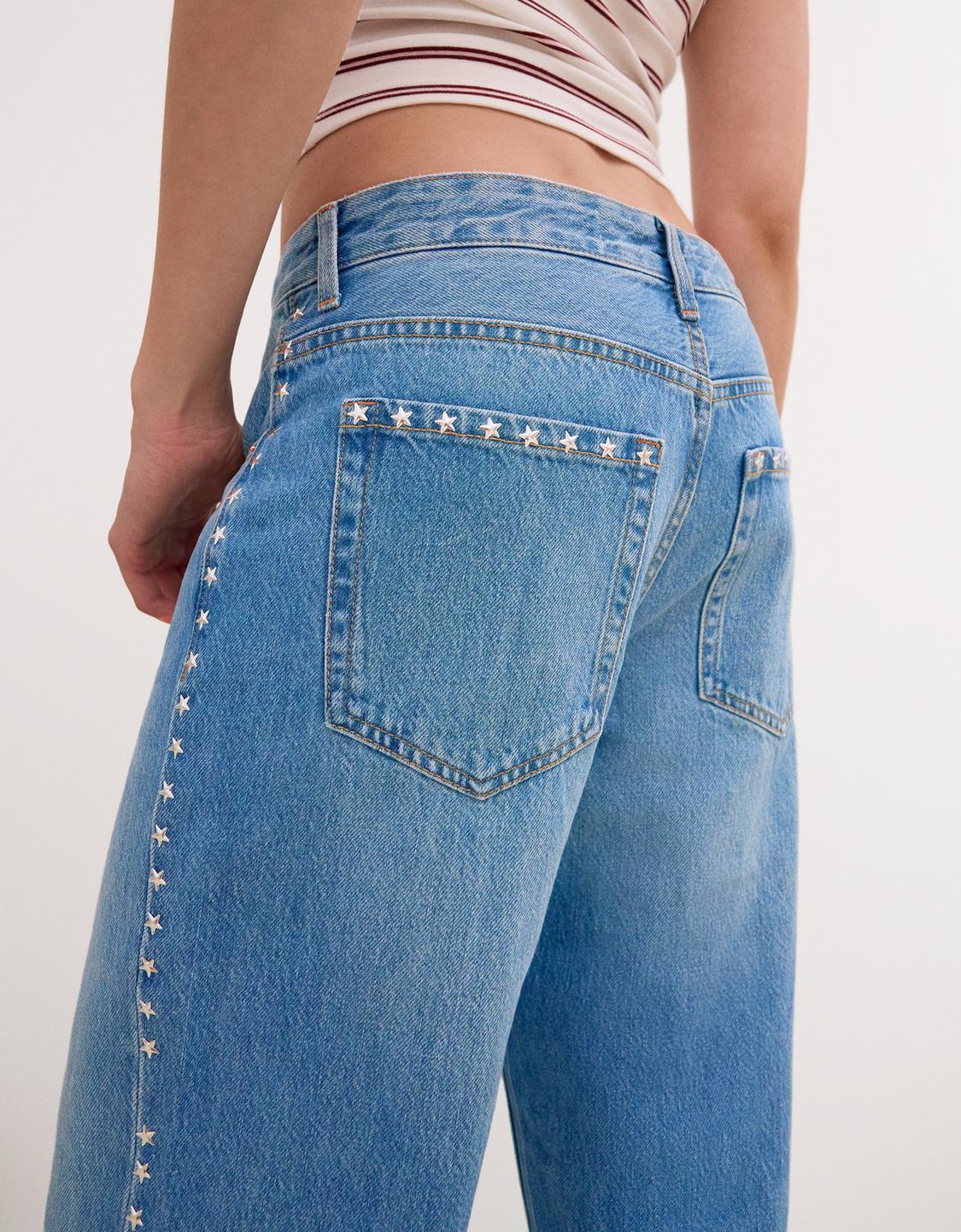 Ripped wide-leg jeans with studs