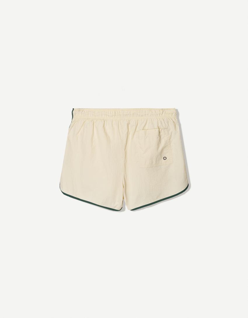 Kurze Badeshorts mit Borte-Sandfarbe