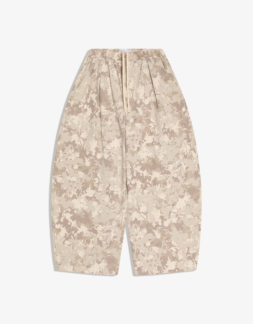 Spodnie o kroju balloon z nadrukiem-Piaskowy