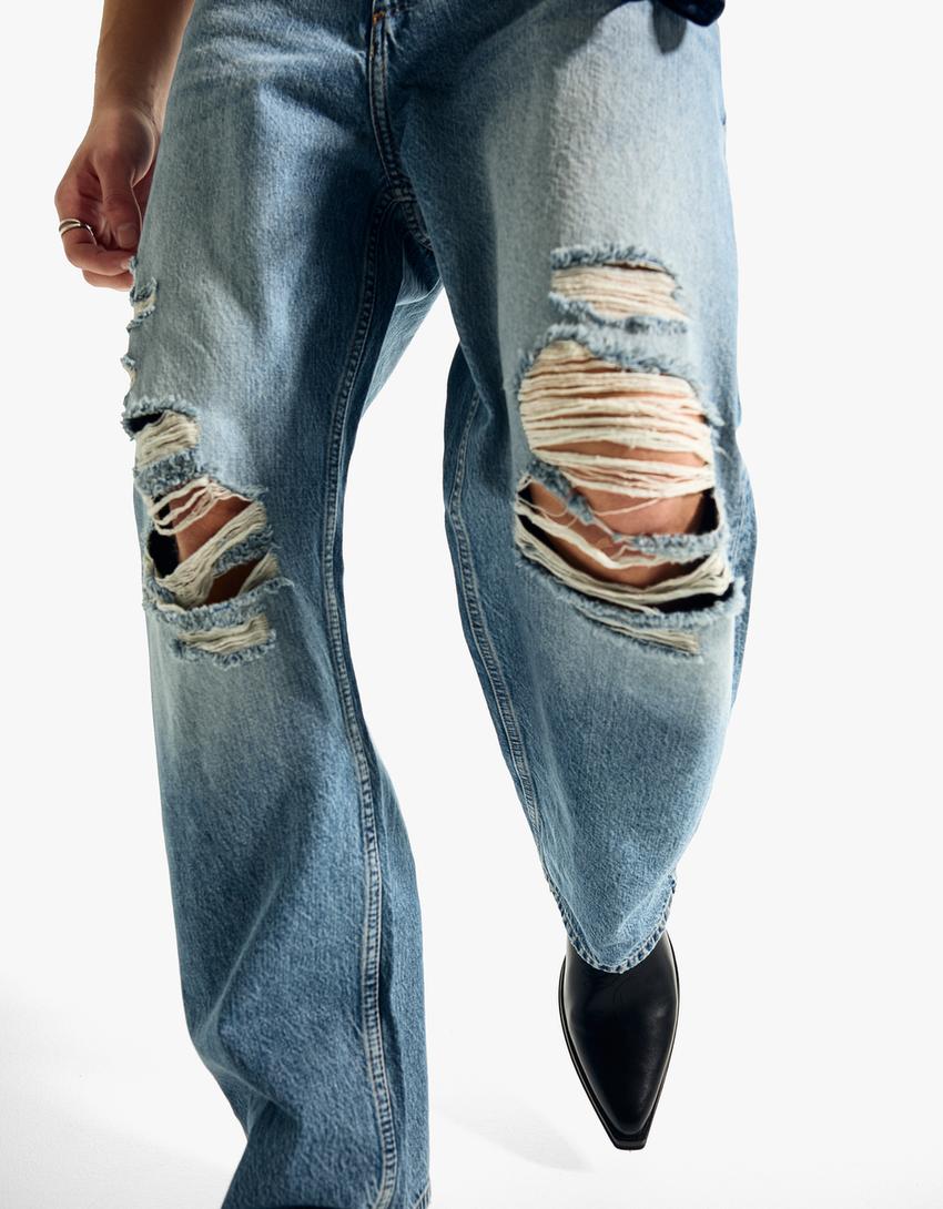 Džinsi ‘baggy fit’ ar plēsumiem-Zils