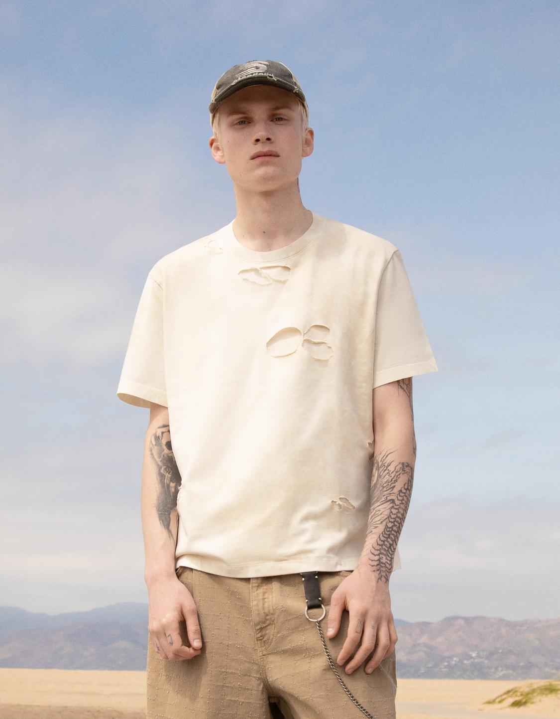Faded-effect short sleeve ripped T-shirt