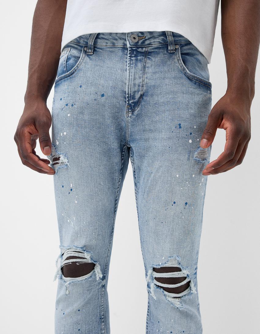 Ripped paint splatter skinny jeans - Men | Bershka