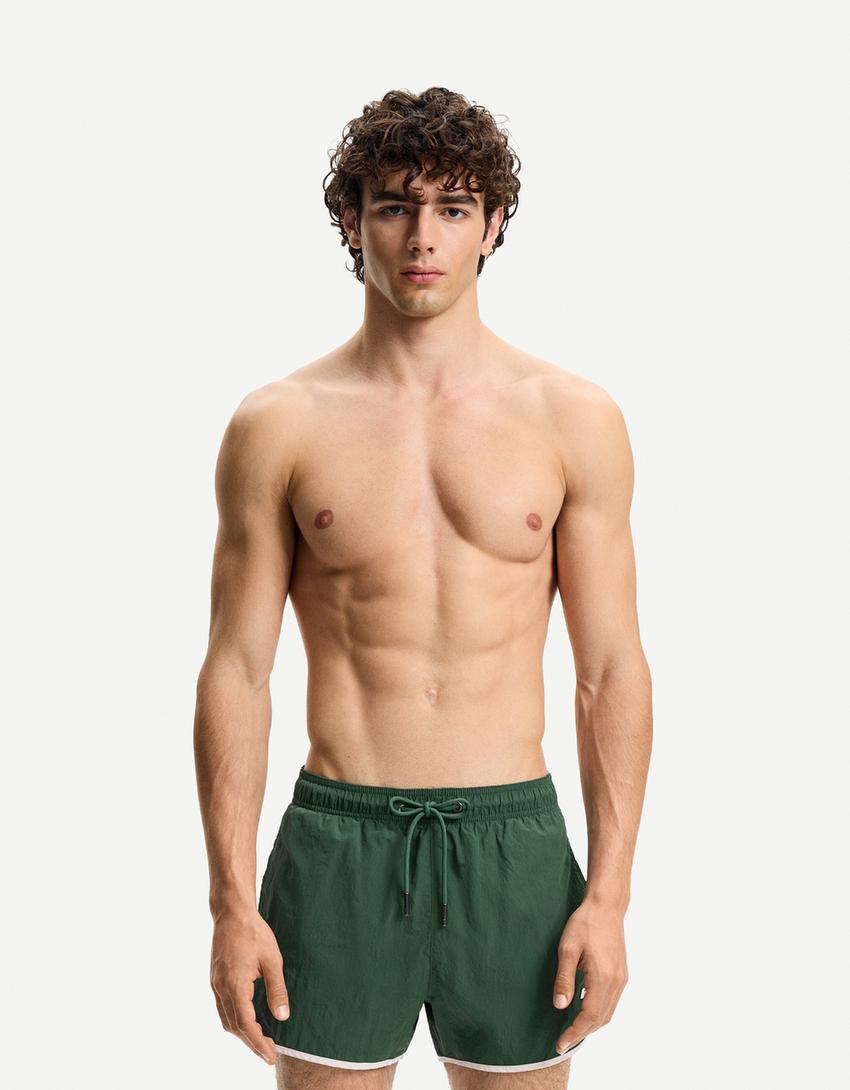 Short swimming trunks with trim-Green