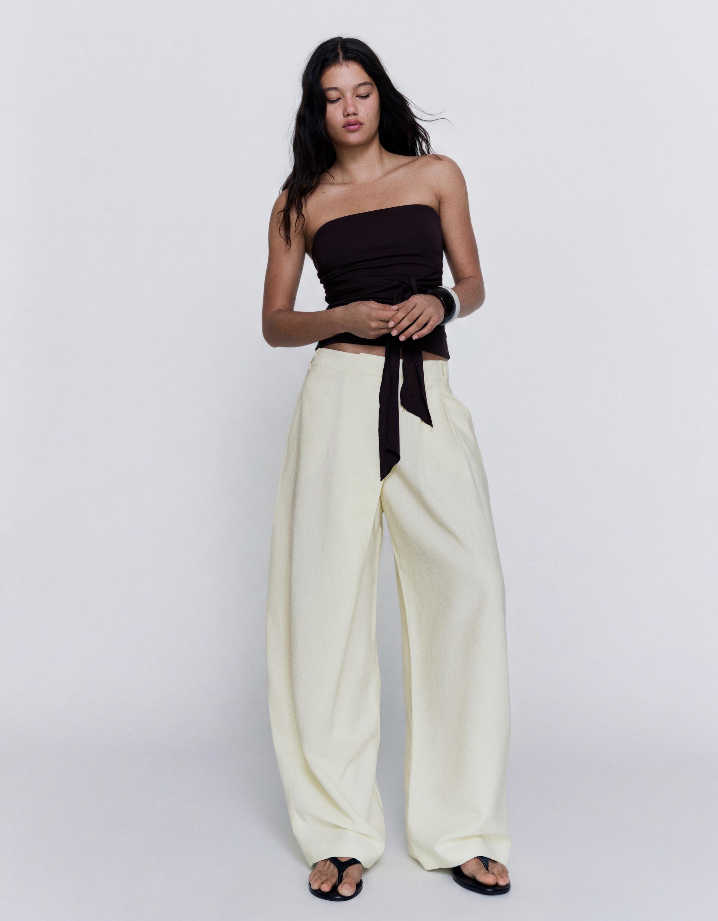 Crossover waist trousers