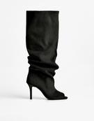 Stiletto heel boots with slits