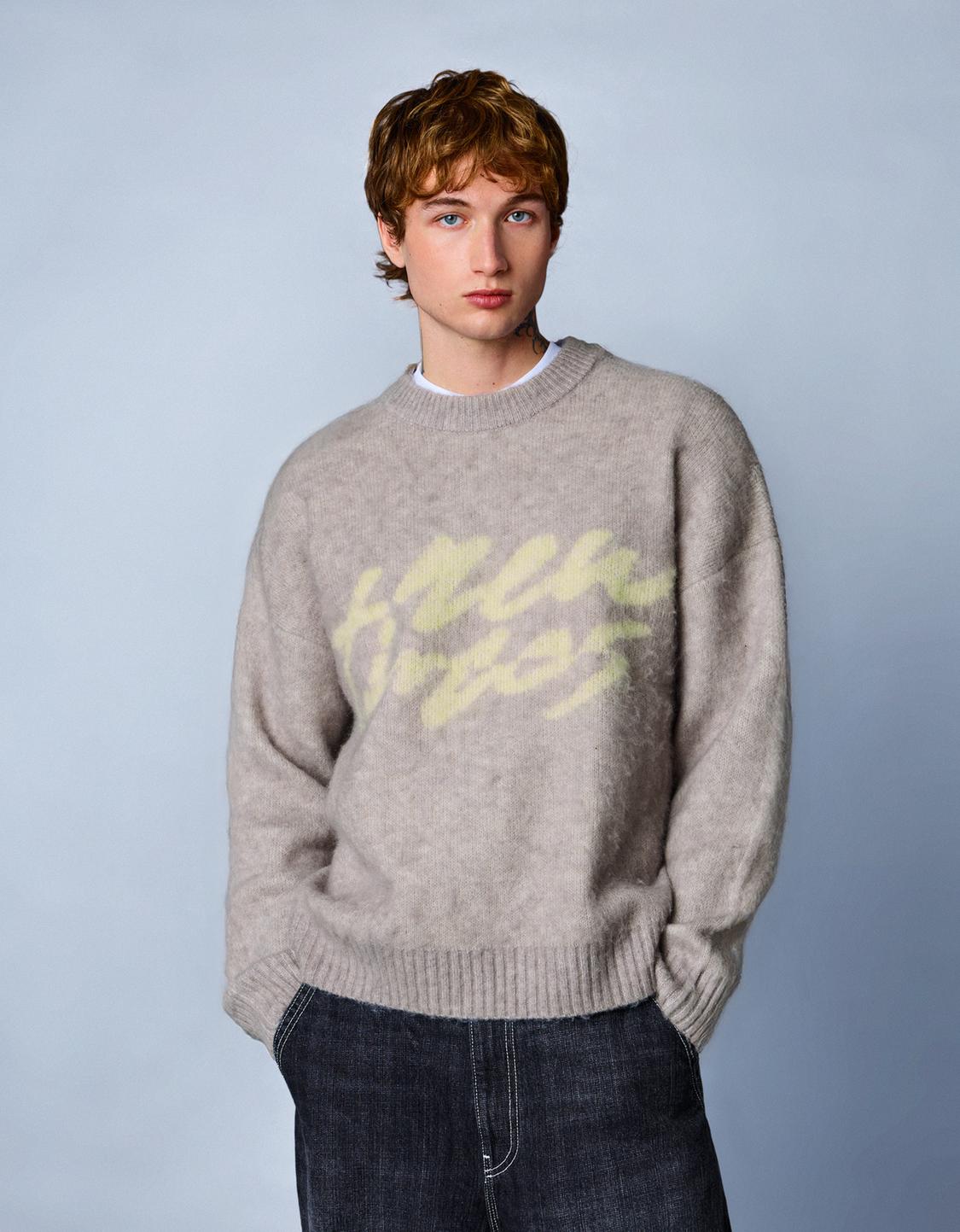 Sweter motif efek sikat