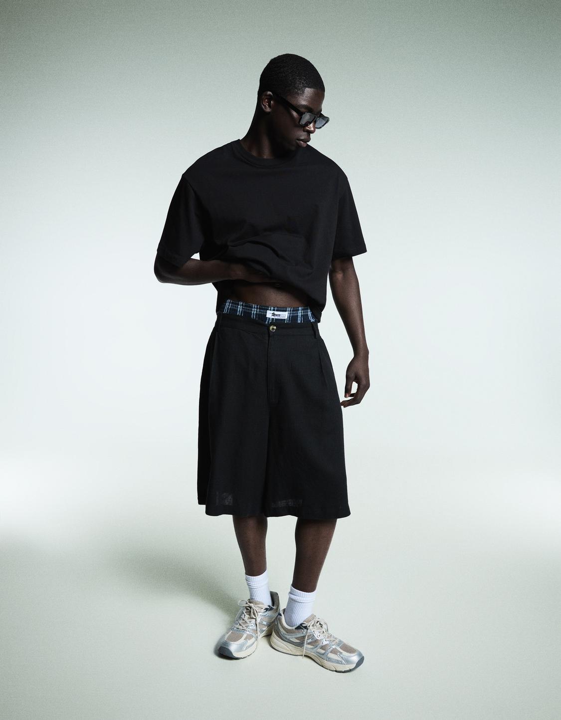 Rustic tailored Bermuda shorts with darts
