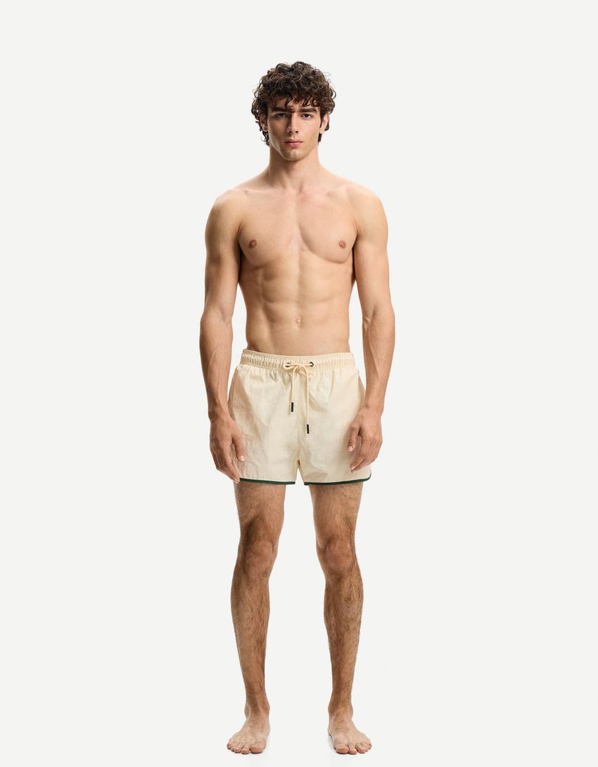 Kurze Badeshorts mit Borte-Sandfarbe